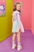 Conjunto infantil kukiê de blusa e saia com shorts embutido - Costas