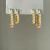 BRINCO DUPLO COM ZIRCÔNIAS BANHADO A OURO 18K - comprar online