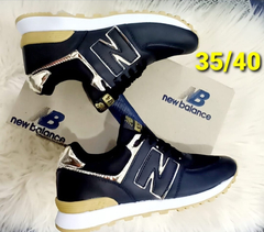 574 Negro/Dorado