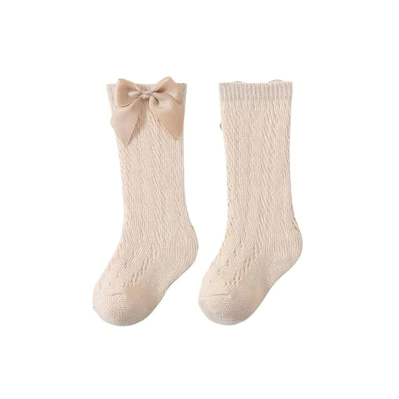 Medias beige caladas con moño