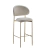 Banqueta Dourada Eloá com design moderno e sofisticado, estofada em tom claro e estrutura metálica dourada.