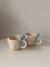 Taza nubecitas coquette - Pochi Ceramic