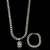 Conjunto de corrente e pulseira de semijoia prata com pingente de imagem religiosa.