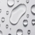 Gotas de líquido transparente sobre superfície branca representando textura do produto Seal Pro Incolor Lara Beauty