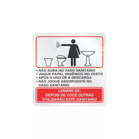 Placa de sinalização com instruções sobre o uso adequado do banheiro feminino, incluindo orientações sobre papel higiênico e manutenção do vaso sanitário.