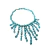 Colar imponente com franjas de pedras naturais turquesa e metais banhados em prata vintage, estilo boho sofisticado.

