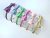 Kit com 6 unidades Tiaras Verniz - Laço M Cruzado CANDY (1 unid/cor) - comprar online