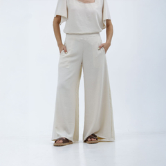 Pantalones palazzo Kalindi color crema, con un diseño amplio y cómodo, perfectos para un look casual.