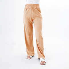 Pantalones palazzo Leida en color durazno, con cintura elástica y bolsillos laterales.