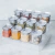 Organizador de Temperos Multinível Block 13 peças. Kit com 12 potes herméticos de 150ml e uma base multinível com 3 planos que permite você visualizar seus temperos com facilidade. 