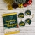 Kit de lembrancinhas de Natal com saquinho de bons desejos e tags decorativas com palavras como união, paz, amor e fé.