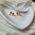 Brincos Little Ribbon Gold [PRATA 925] - Del Moon
