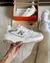 New Balance 550 White/Gold en internet