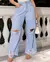 CALÇA JEANS CROPPED FLARE FEMININA CINTURA MÉDIA BARRA DESFIADA E RASGOS na internet
