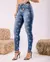 CALÇA JEANS SKINNY FEMININA CINTURA MÉDIA DETALHES DE ESTRELA NO LASER na internet