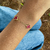 Pulseira Três Trevos Vermelho Banhado a Ouro 18 K - comprar online