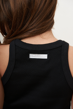 MUSCULOSA ANTI HERO CON TACHITAS NEGRA - Gimos Tienda Mayorista
