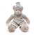 Urso de pelúcia Archer usando um macacão linda e um gorro listrado, sentado com braços abertos.