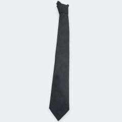 Corbata negra con puntos blancos, ideal para ocasiones formales.