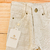 Calça jeans bege na internet