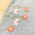 Romper jardineira tricot azul flores na internet