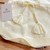 Romper Jardineira pompom amarelo Tricot - comprar online