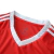 Camisa Internacional I 2025/26 masculina oficial, cor vermelha, escudo retrô dos anos 70, gola V branca com detalhes circulares, três listras brancas da Adidas nos ombros, recortes laterais brancos, detalhe "1975" na nuca, sem patrocínios, calção e meiões