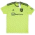 Camisa Manchester United Adidas 2022/23 Masculina em verde limão vibrante, com padrão geométrico de triângulos e listras. Gola redonda e ombros em azul marinho, escudo e logo Adidas em azul. Uma peça exclusiva celebrando a identidade gráfica do clube.