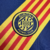 Camisa reserva do Girona FC 2024/2025: azul marinho com faixa diagonal em amarelo e vermelho, inspirada na bandeira da Catalunha. Destaques incluem o escudo do clube, logo PUMA e patrocínio Etihad.