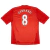 Camisa Retro Titular do Liverpool 2010-2012 em vermelho e branco. Camisa oficial usada durante a temporada turbulenta após a saída de Rafa Benítez e a chegada de Roy Hodgson. A equipe se recuperou com a volta de Kenny Dalglish e a contratação de Luis Suár