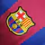 Camisa titular do Barcelona temporada 2023/24 masculina torcedor de volta as cores blaugranas tradicionais em faixas verticais, sendo duas grenás com uma central azul, com bordas serrilhadas. No template da marca americana para a temporada, os ombros e o 