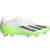 Chuteira de Campo Adidas X Crazyfast.1 FG Laceless Crazyrush nas cores verde, branco e preto. A chuteira está posicionada de lado, exibindo seu design minimalista e inovador. Detalhes em destaque incluem o cabedal Aeropacity Speedskin semi-translúcido, a 