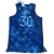 Regata  do Golden State Warriors com o nome e número 30 do Stephen Curry nas costas. A regata possui um design único e vibrante em tons de azul, roxo e preto, inspirado no uniforme usado pelo Curry na temporada 2022/23 da NBA.