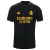 Terceira Camisa Real Madrid Adidas 2023/24 Masculina em preto, amarelo e cinza, destacando as três listras cinzas nas mangas, gola redonda com abertura de um botão e escudo amarelo vazado no peito. Logo Adidas e patrocínio Emirates em amarelo.