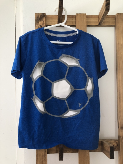 6A | Remera azul con pelota MC. OLD NAVY. 6/7 años.