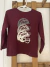 Remera ML bordo con cascos. GARANIMALS. 3 años.