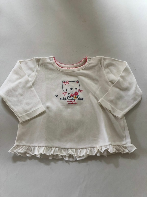 Remera blanca con volados abajo. MIMO. 9/12 meses