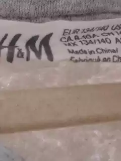 10A | OUTLET - Buzo canguro gris c lentejuelas "Tyrannosaurius Rex" - H&M - Talle 10 años en internet