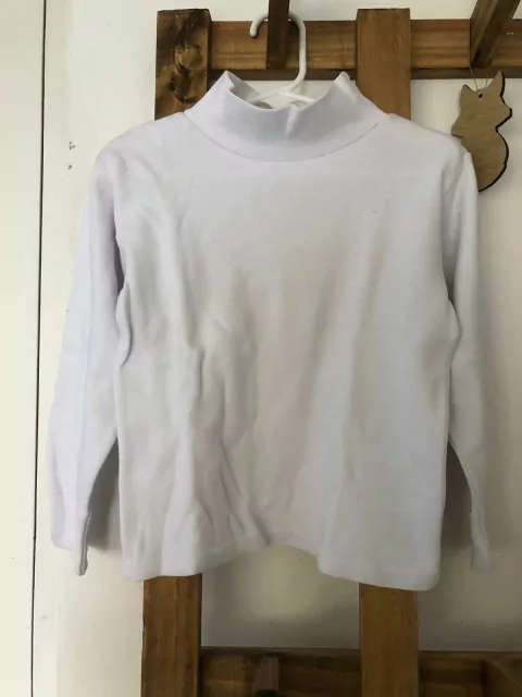 Polera blanca. Rocha talle 6. Es para 4 años.