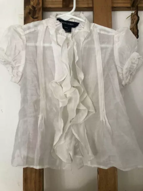 Blusa MC blanca con volados. TOMMY. Talle 4 años. Parece más 3 años.