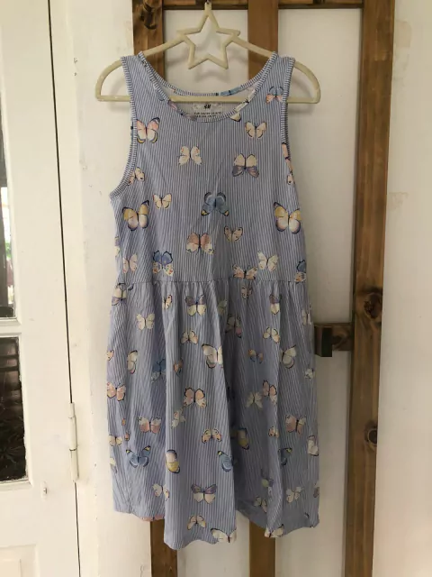 Vestido sin mangas celeste con mariposas. HYM. 8/10 años. Como nuevo.