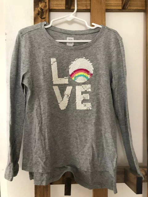 Remera gris ML gris con lentejuelas. GAP. 6/7 años.