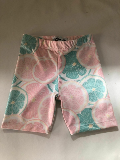 Calza rosa y turquesa con frutas. IKAIKA. Dice talle 8 pero es para 4/5 años. Mide de cintura 25 cm.
