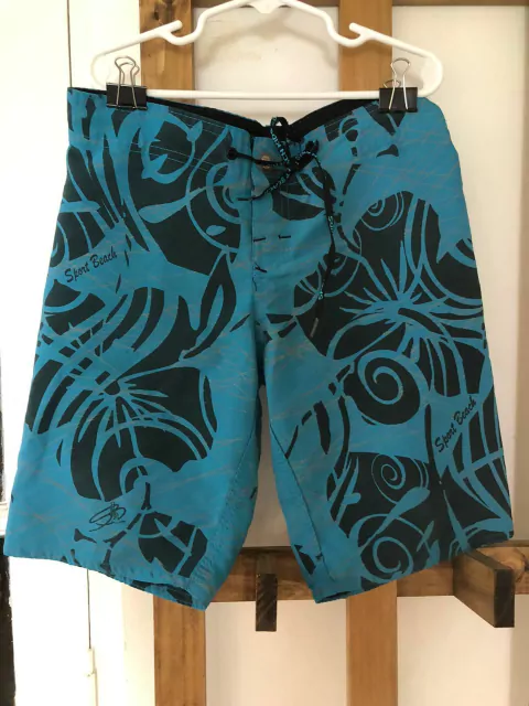 8A | Traje de baño azul y celeste con flores y cordón. No tiene red adentro. Talle 8 años. La cintura mide 32 cm.