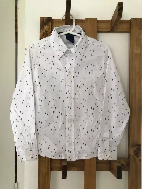 6A | OUTLET- Camisa ML blanca con pinitos. MIMO. Talle 6. Manchita en puño.