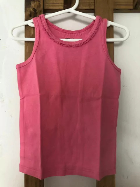 Remera rosa sin mangas con voladito. CARTERS. 3 años.