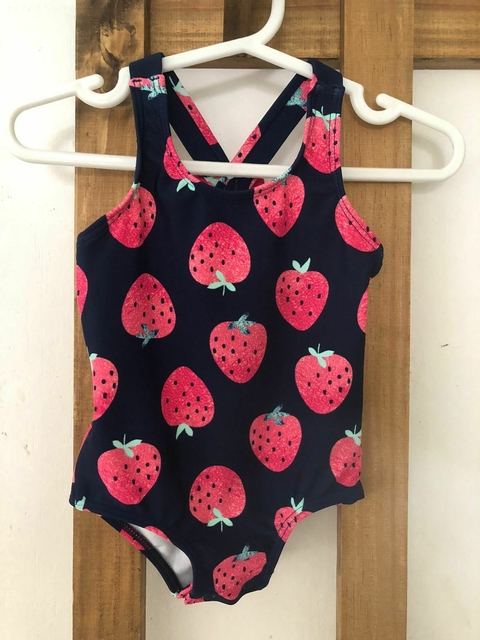 6M | Traje de baño azul con frutillas, cruzado atrás con moño. CARTERS. 6 meses. Como nuevo.