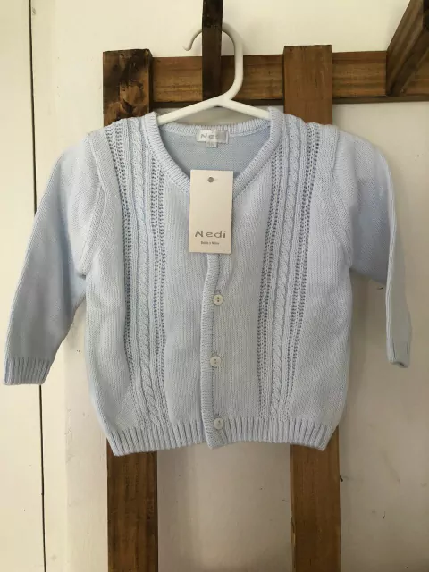 NUEVO- Saco prendido celeste. NEDI. 9 meses.