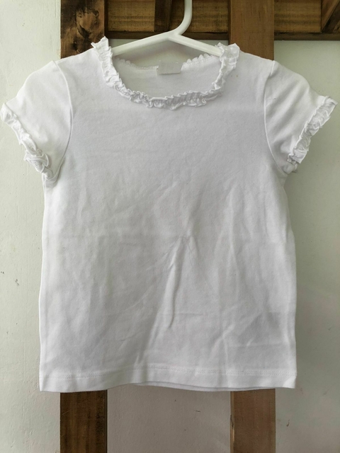 Remera blanca MC. HYM. 9 meses.