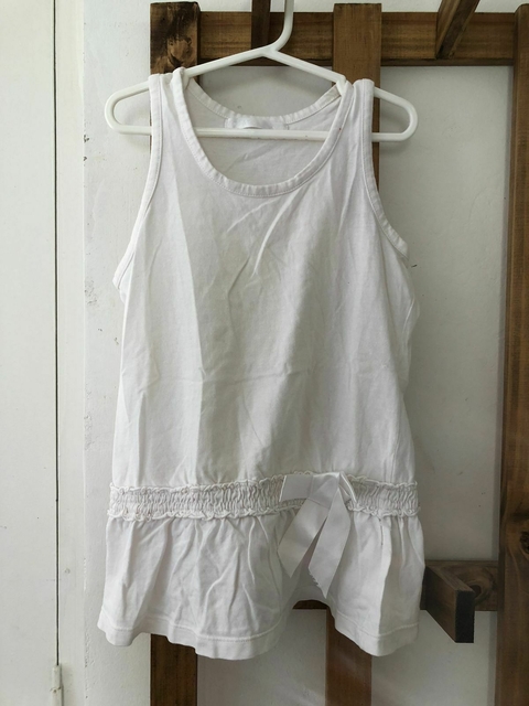 10A | Musculosa blanca con moño. MIMO. Talle 10 años.